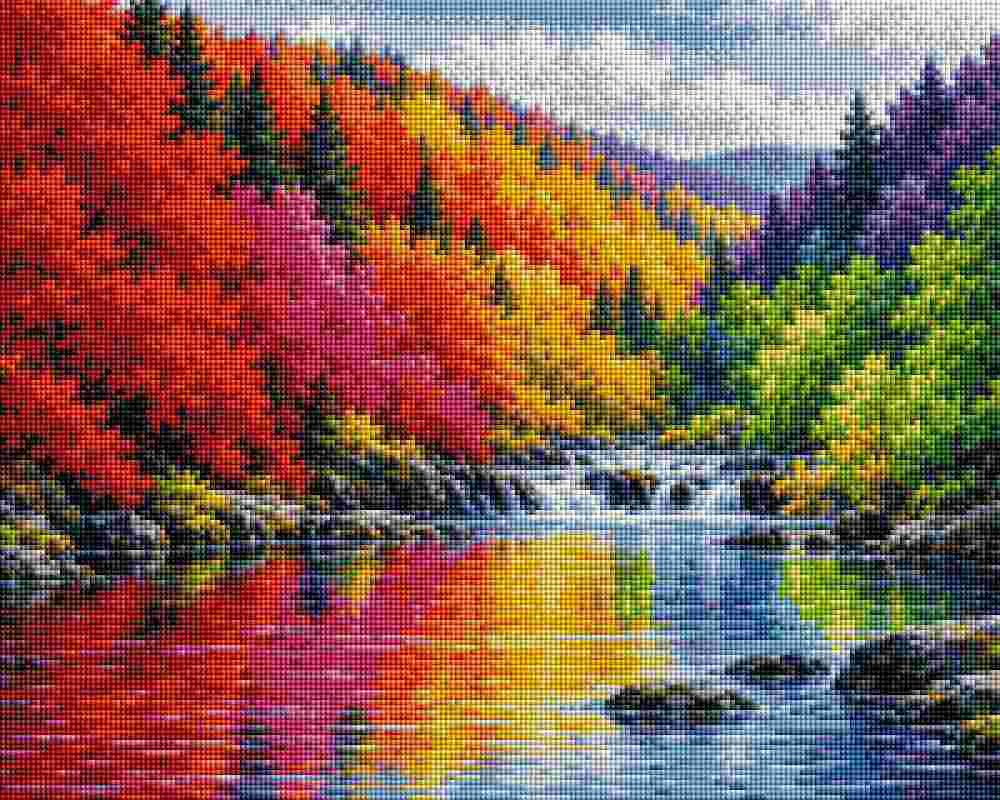 A colorful autumn landscape artwork showing a river with a small waterfall, surrounded by hillsides covered in red, orange, yellow, green, and purple trees under a pale sky. Colored Trees - Diamond Art