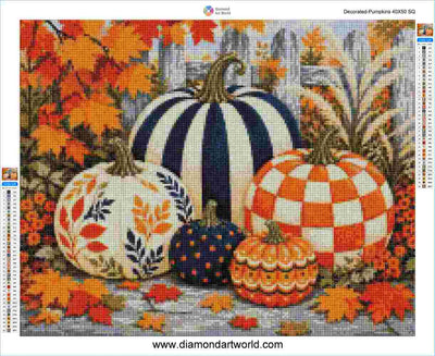 A diamond painting design sheet titled 'Decorated Pumpkins' featuring five decorative pumpkins in autumn colors, surrounded by orange and yellow maple leaves. The pumpkins include black and white stripes, orange and white checkers, a white pumpkin with orange and blue leaf patterns, a dark blue pumpkin with orange dots, and a small orange pumpkin with yellow and orange patterns.