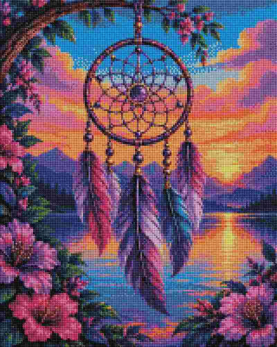 A colorful dreamcatcher hanging from a tree branch above a lake at sunset, surrounded by pink flowers and mountains in the background. The artwork has a pixelated, needlepoint-like texture. Purple Dreamcatcher - Diamond Art